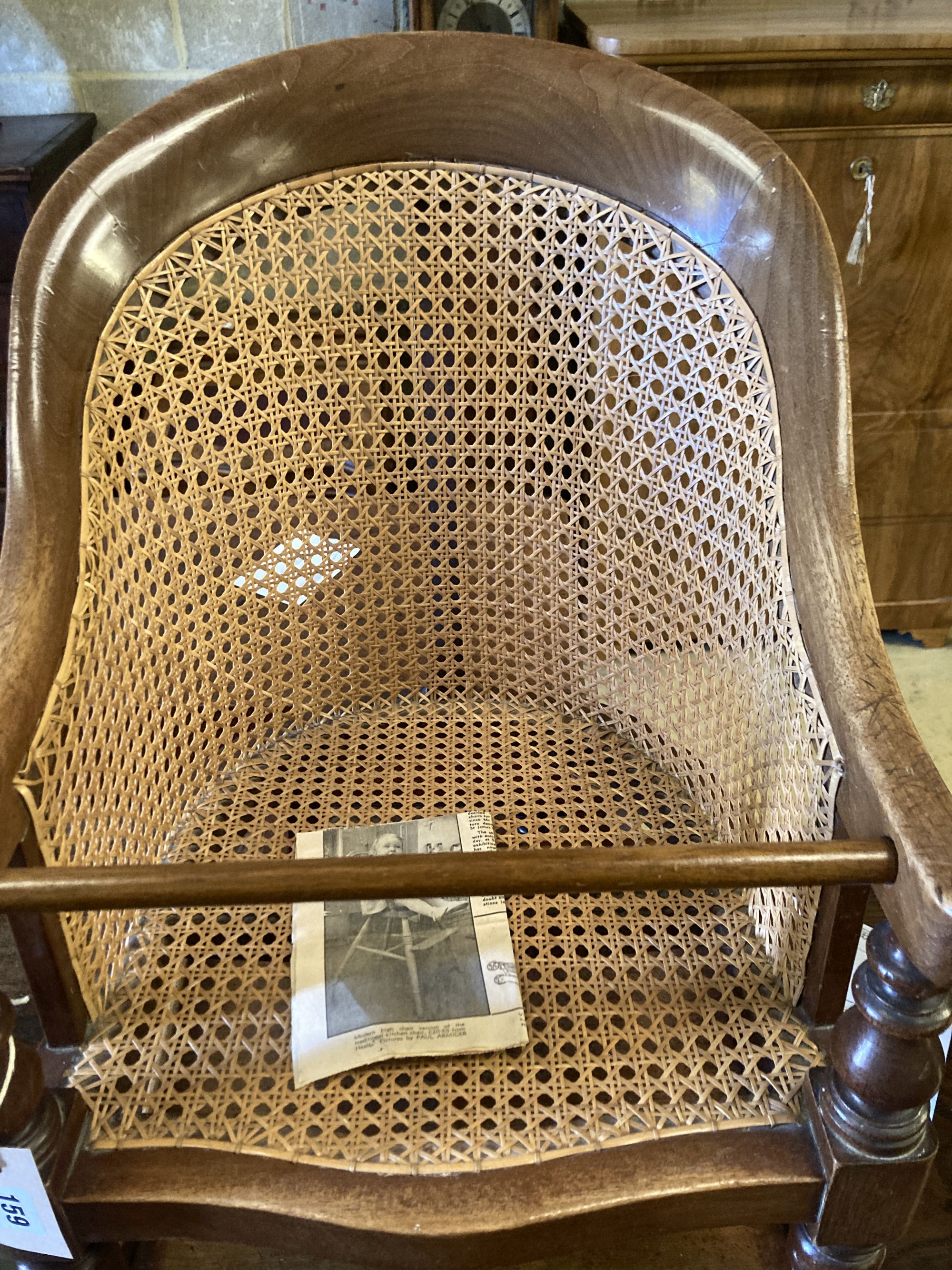 An early Victorian caned mahogany childs high chair on stand, width 42cm, depth 42cm, height 94cm